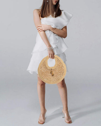 Chic Woven Raffia Circle Bag with Gold Charm Pendant